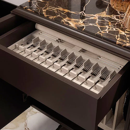 Orvia sideboard with cutlery-lined drawer, highlighted by a refined Portoro marble top detail.